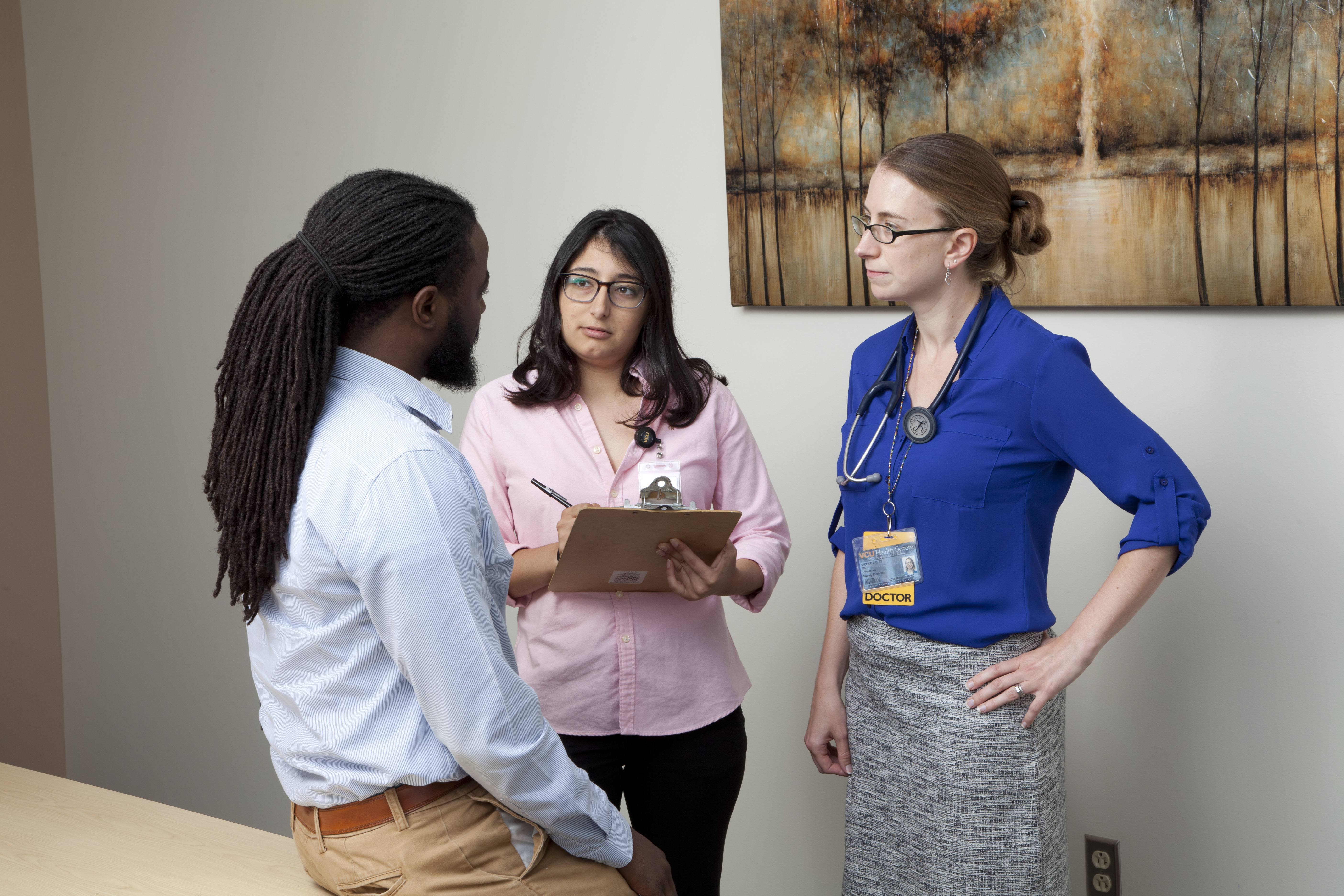 trainees in clinic with patient